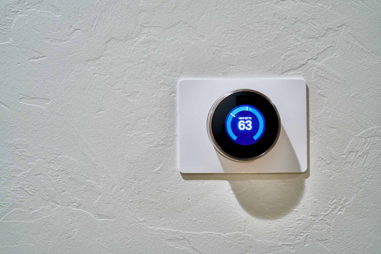 picture of a smart thermostat installed in a home