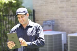 HVAC technician done installing a Carrier HVAC unit