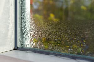 Window with condensation because an HVAC unit is broken.